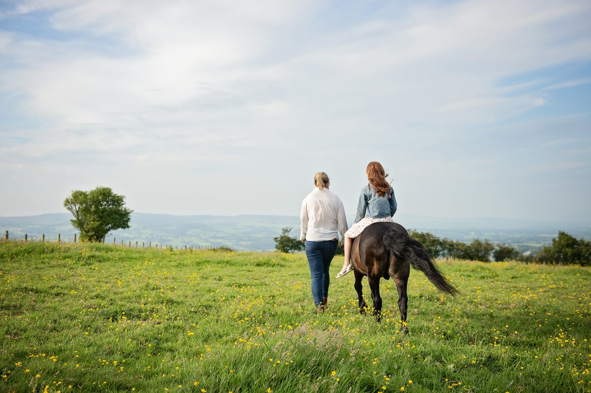 With Mum - having a photoshoot with their pony Razz